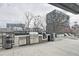 A modern outdoor kitchen on a patio with a stainless steel grill, sink, and countertop, perfect for entertaining at 788 W Marietta Nw St # 913, Atlanta, GA 30318