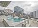 Rooftop pool and spa area with comfortable lounge chairs and city views at 788 W Marietta Nw St # 913, Atlanta, GA 30318