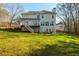 The level backyard features a deck, a patio, and plenty of room to play at 1516 Ashford Club Ne Ct, Brookhaven, GA 30319