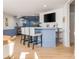 Basement with bar, barstools, and TV above bar at 1516 Ashford Club Ne Ct, Brookhaven, GA 30319