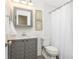 Bathroom with gray vanity, framed mirror and shower with white curtain at 1516 Ashford Club Ne Ct, Brookhaven, GA 30319