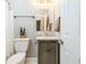 Cozy bathroom with gray accents, a vanity with storage, and a shower-tub combination at 1516 Ashford Club Ne Ct, Brookhaven, GA 30319