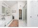 Bright bathroom with walk-in shower, soaking tub, dual vanity, and modern fixtures at 1516 Ashford Club Ne Ct, Brookhaven, GA 30319