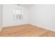 Bright bedroom with hardwood floors and large window at 1516 Ashford Club Ne Ct, Brookhaven, GA 30319