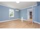 Bedroom with new floors and blue painted walls at 1516 Ashford Club Ne Ct, Brookhaven, GA 30319