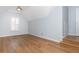 Bedroom with hardwood floors, vaulted ceilings and large window at 1516 Ashford Club Ne Ct, Brookhaven, GA 30319