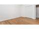 Bright bedroom with hardwood floors and closet with bi-fold doors at 1516 Ashford Club Ne Ct, Brookhaven, GA 30319