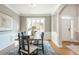 Formal dining room featuring hardwood floors, wainscotting, and large windows at 1516 Ashford Club Ne Ct, Brookhaven, GA 30319