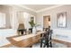 Stylish dining room with a hardwood floors and an elegant staircase in the background at 1516 Ashford Club Ne Ct, Brookhaven, GA 30319