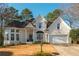 Charming brick home with a well-manicured lawn and attached two car garage at 1516 Ashford Club Ne Ct, Brookhaven, GA 30319