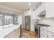 Bright kitchen featuring stainless steel appliances, white cabinetry, and an open layout at 1516 Ashford Club Ne Ct, Brookhaven, GA 30319