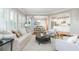 Inviting living room featuring large windows, hardwood floors, and an open floor plan at 1516 Ashford Club Ne Ct, Brookhaven, GA 30319