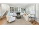 Bright and airy living room featuring built-in shelving, a fireplace, and comfortable seating arrangement at 1516 Ashford Club Ne Ct, Brookhaven, GA 30319