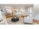 Open-concept living room showcasing hardwood floors and seamless transition to the kitchen at 1516 Ashford Club Ne Ct, Brookhaven, GA 30319