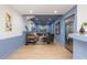 View of the home's open-concept living room with refinished wood floors and blue walls at 1516 Ashford Club Ne Ct, Brookhaven, GA 30319