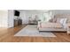 Spacious main bedroom featuring hardwood floors, accent wall, and a soft rug at 1516 Ashford Club Ne Ct, Brookhaven, GA 30319