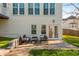 Backyard patio with outdoor seating and grassy area at 1516 Ashford Club Ne Ct, Brookhaven, GA 30319