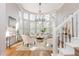 Bright sitting area featuring a decorative chandelier and hardwood flooring at 1516 Ashford Club Ne Ct, Brookhaven, GA 30319