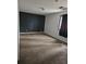Bedroom with plush carpeting and a black accent wall creates a bold and inviting space at 135 Windy Hill Rd, Fayetteville, GA 30214