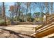 Fenced backyard with shed, fire pit, and patio area, offering outdoor living space at 4122 Antler Se Trl, Smyrna, GA 30082