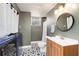 Renovated bathroom featuring patterned tile floors, vanity, and a shower at 4122 Antler Se Trl, Smyrna, GA 30082