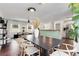 Open-concept dining room flowing into a living space, featuring a modern dining set and stylish decor at 4122 Antler Se Trl, Smyrna, GA 30082