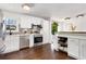 Bright kitchen featuring white cabinets, stainless steel appliances, and dark hardwood flooring at 4122 Antler Se Trl, Smyrna, GA 30082