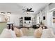 Bright living room with modern furnishings, large windows, and a stylish ceiling fan at 4122 Antler Se Trl, Smyrna, GA 30082