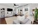 Comfortable living room featuring plush seating, stylish decor, and ample natural light through large windows at 4122 Antler Se Trl, Smyrna, GA 30082