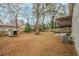Lush backyard with mature trees, featuring a shed for extra storage at 2917 Toney Dr, Decatur, GA 30032