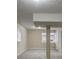 Finished basement area with neutral walls, carpet flooring and support columns at 2917 Toney Dr, Decatur, GA 30032