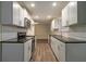Modern kitchen with stainless steel appliances, granite countertops and bright white cabinets at 2917 Toney Dr, Decatur, GA 30032