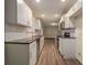 Galley kitchen featuring sleek countertops, subway tile backsplash, and modern stainless steel appliances at 2917 Toney Dr, Decatur, GA 30032