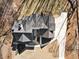 Overhead shot of the black roof on a modern home with a gray driveway and green and brown yard at 7760 E Cherokee Dr, Canton, GA 30115