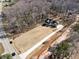 Aerial view of a modern farmhouse on a large lot with a long driveway at 7760 E Cherokee Dr, Canton, GA 30115