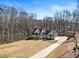 Traditional meets modern in this black and white farmhouse, on a large lot and backing to wooded property at 7760 E Cherokee Dr, Canton, GA 30115