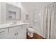 Well-lit bathroom with a shower-tub combo, patterned curtain, and modern fixtures at 804 White St, Villa Rica, GA 30180