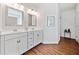 Bathroom with dual sink vanity, modern fixtures, and decorative mirrors for an updated look at 804 White St, Villa Rica, GA 30180