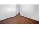 This bedroom features beautiful hardwood floors, crisp white walls, and doors at 804 White St, Villa Rica, GA 30180