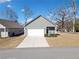 Charming single-story home featuring a two-car garage and beautifully maintained front yard at 804 White St, Villa Rica, GA 30180