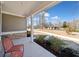 Inviting front porch with stone accents, a seating area, and landscaped surroundings at 804 White St, Villa Rica, GA 30180