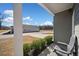 Inviting front porch with a seating area, and landscaped surroundings, overlooking property at 804 White St, Villa Rica, GA 30180