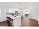 Modern kitchen with stainless steel appliances, a large island with seating, and sleek white cabinetry at 804 White St, Villa Rica, GA 30180