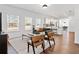 Open-concept living room with bright windows, modern furniture, and hardwood floors for a comfortable atmosphere at 804 White St, Villa Rica, GA 30180