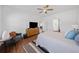 Bright and airy bedroom offering a neutral color palette, wood floors, and a seating area at 804 White St, Villa Rica, GA 30180