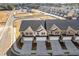 Aerial view of new construction townhomes with attached garages and community landscaping at 941 Elwood St, Dacula, GA 30019