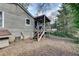 Backyard view featuring the exterior of the house with a deck and stairs at 2312 Wayside Ne Dr, Brookhaven, GA 30319