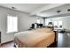 Comfortable bedroom with hardwood floors, a bed, and a study desk at 2312 Wayside Ne Dr, Brookhaven, GA 30319