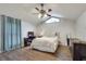 Comfortable bedroom with a ceiling fan, window, and dark wood-look flooring at 2312 Wayside Ne Dr, Brookhaven, GA 30319