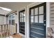 Dual front door entryway featuring two black doors, a small step, and natural light from windows above at 2312 Wayside Ne Dr, Brookhaven, GA 30319